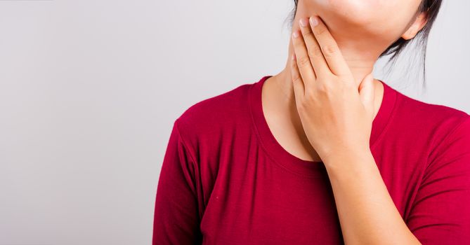 Asian beautiful woman itching her scratching her itchy neck on white background with copy space, Medical and Healthcare concept