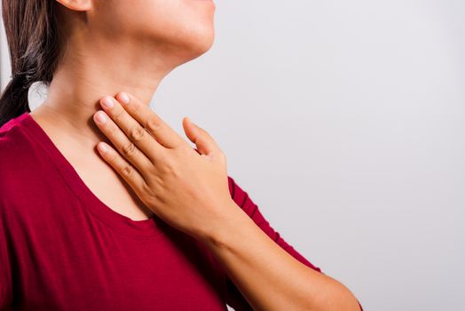 Asian beautiful woman itching her scratching her itchy neck on white background with copy space, Medical and Healthcare concept