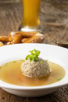 bavarian liver dumpling soup on wood