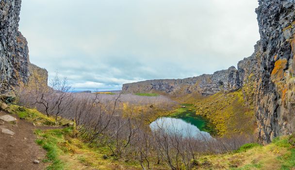 Asbyrgi Canyon in Northern Iceland panorama of the forrest between cliffs during autumn day