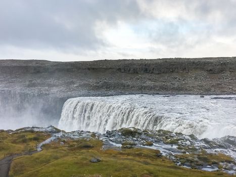 Dettifoss waterfall in Iceland huge masses of water falling down over cliff