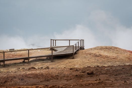 Geo Thermal hot spring activity in Iceland Gunnuhver Hot Springs empty wooden walkway