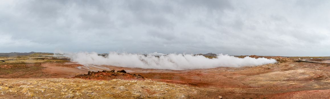 Geo Thermal hot spring activity in Iceland Gunnuhver Hot Springs steam cloud during heavy wind
