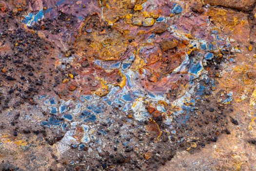 Geo Thermal hot spring in Iceland Gunnuhver Hot Springs muddy colorful rock sediments on rocks