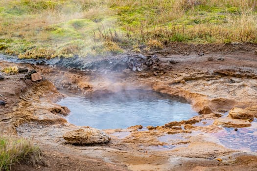 Geysir Golden Circle in Iceland boiling hot geothermal spring spitting mud and water