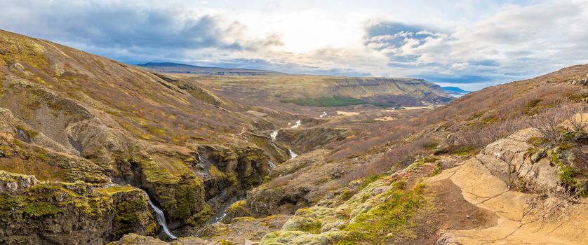 Glymur waterfall in Iceland panorama of gorge behind fall and river leading downwards to the lake