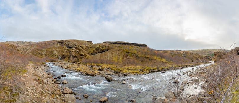 Glymur waterfall in Iceland panorama of river behind the fall during fall