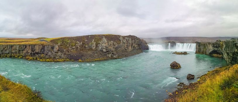 Godafoss waterfall in Iceland panorama of plunge pool turquoise water in autumn