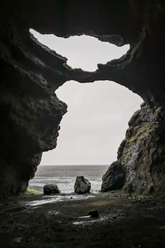 Hjoerleifshoefdi Cave in Iceland from inside cave entrance in the shape of master yoda