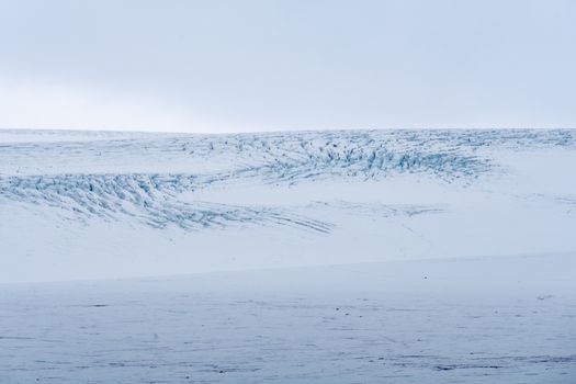 Langjokull Glacier ice crevice crevasse high up standing deep blue ice