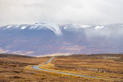 Mountain pass towards Akureyri in Iceland clouds and snow starting to cover mountain peaks