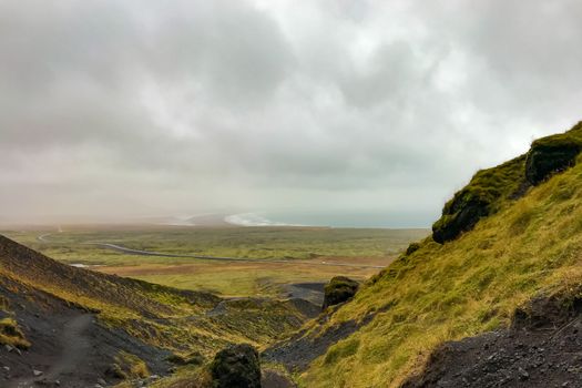 Snaefellsness national park in Iceland Raudfeldsgja gorge view towards coast during heavy rainfall