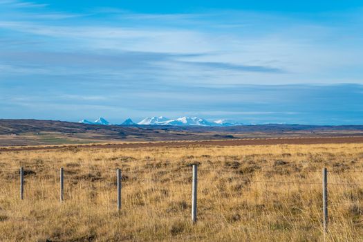 Snaefellsness national park in Iceland scenic landscape in front of snow covered mountain range at horizon
