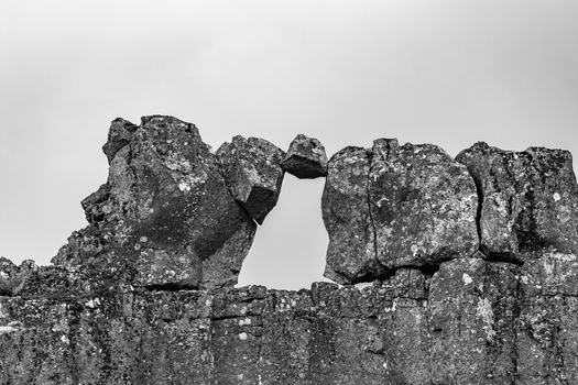 Thingvellir National Park in Iceland rock stuck between other rocks in black and white