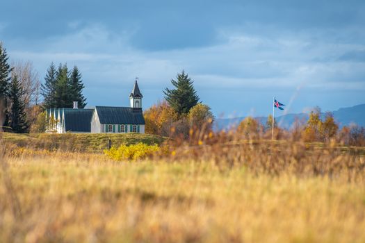 Thingvellir National Park in Iceland wooden church and icelands flag