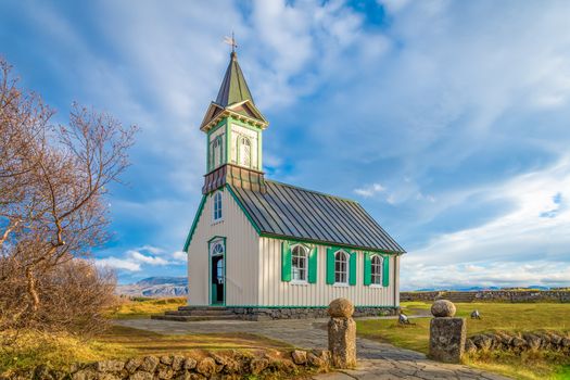 Thingvellir National Park in Iceland wooden church in front of sunny nature
