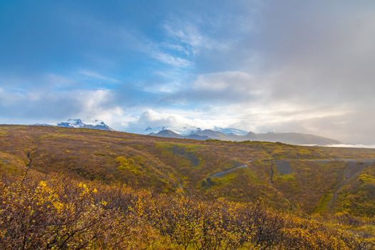 Vatnajoekull glacier colorful autumn landscape in front of the icy mountain tops