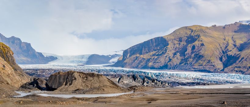 Vatnajoekull glacier in Iceland deep blue ice crevasse during sunshine