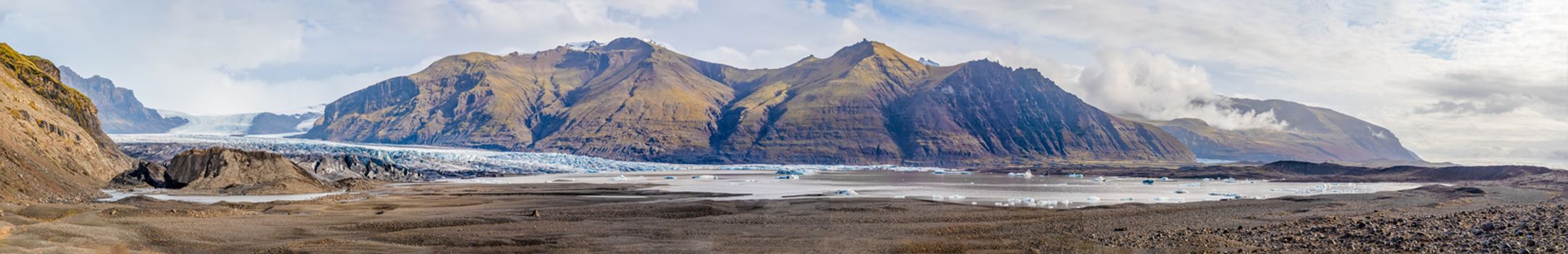 Vatnajoekull glacier in Iceland panorama of glacier and its lake filled with molten ice during sunny day
