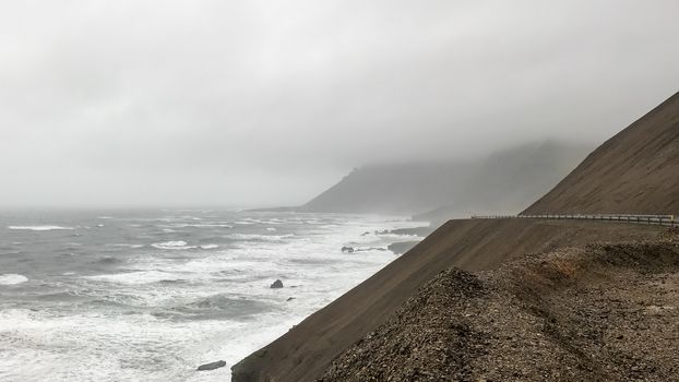 Volcanic mountains of Iceland meeting Atlantic Ocean at Eastfjords in eastern Iceland