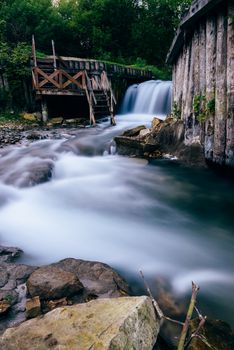 Small river with waterfall flowing through rocks