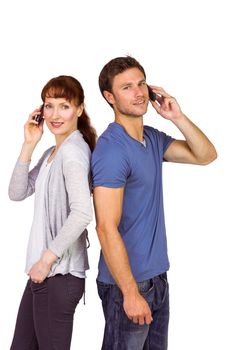 Couple both making phone calls on their mobile phones