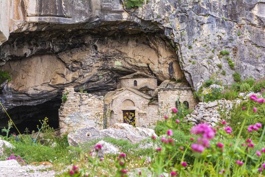 Orthodox monastery enclosed by Davelis cave in Penteli, a mountain to the north of Athens, Greece.