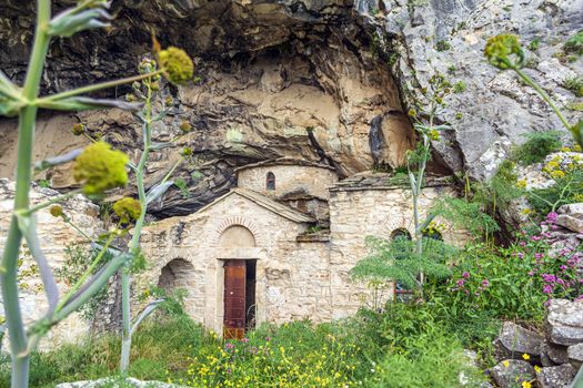 Orthodox monastery enclosed by Davelis cave in Penteli, a mountain to the north of Athens, Greece.