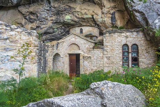 Orthodox monastery enclosed by Davelis cave in Penteli, a mountain to the north of Athens, Greece.