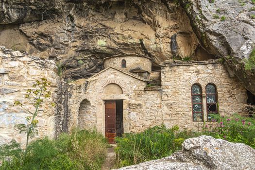 Orthodox monastery enclosed by Davelis cave in Penteli, a mountain to the north of Athens, Greece.