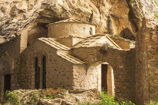 Orthodox monastery enclosed by Davelis cave in Penteli, a mountain to the north of Athens, Greece.