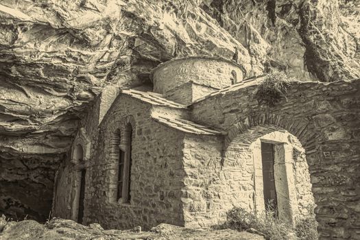 Orthodox monastery enclosed by Davelis cave in Penteli, a mountain to the north of Athens, Greece.