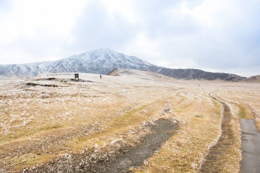 Mount Aso and Kusasenri in winter. covered by golden yellow grassland - Kumamoto, Japan