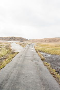 Mount Aso and Kusasenri in winter. covered by golden yellow grassland - Kumamoto, Japan