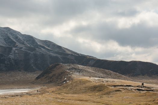 Mount Aso and Kusasenri in winter. covered by golden yellow grassland - Kumamoto, Japan