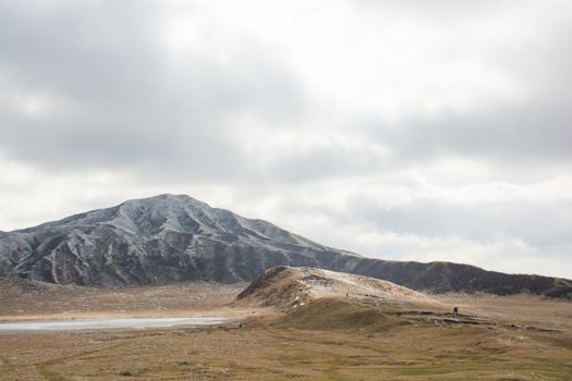 Mount Aso and Kusasenri in winter. covered by golden yellow grassland - Kumamoto, Japan