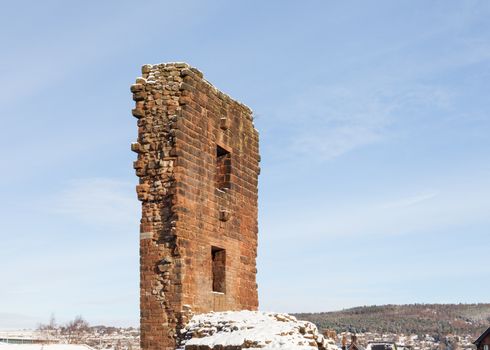 A view of Penrith Castle and beyond to Beacon Hill in Penrith, Cumbria in northern England on a winter morning.  The 14th century castle was built as a defence from Scottish invaders.