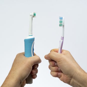 the contrast of an electric toothbrush with a traditional one