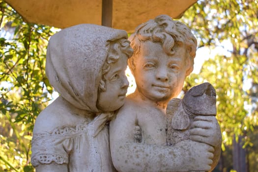 A close up of a statue of a young couple