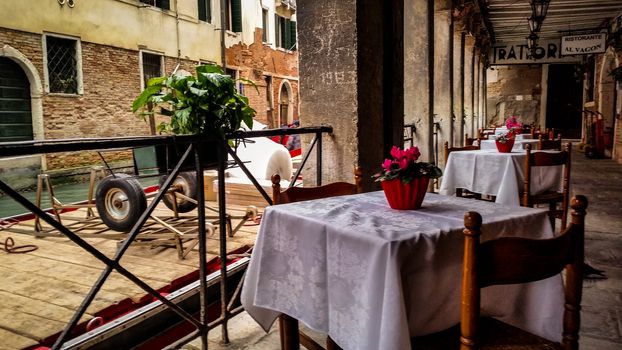 Coffee table of a restaurant in Venice near a river