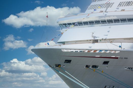 Bow of a luxury cruise ship tied up at port