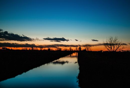 Blue hour in the countryside in Italy in winter