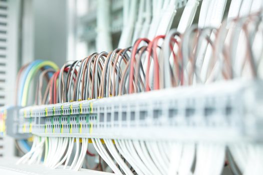 electric working on a clean modern switchboard