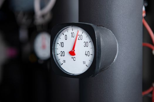 Pipes and gauge in heating and copy space space.