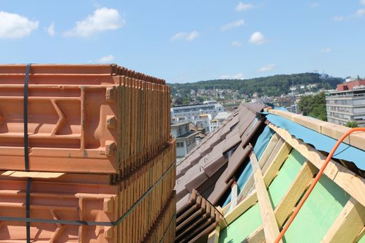 roofing work on a house on Lucerne Switzerland. With blue sky