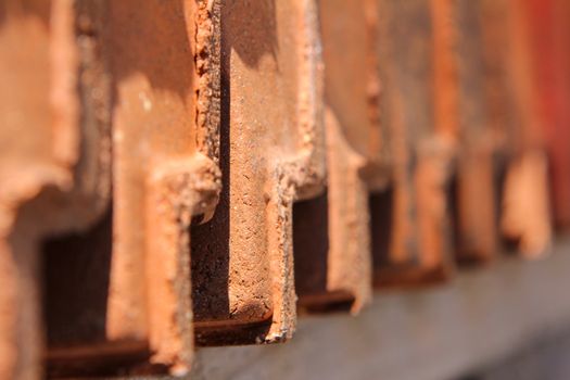 red roofing tiles lined up in a row. Close up of roofing times