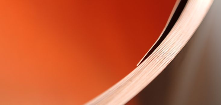 rolls of sheet metal in warehouse, with orange color