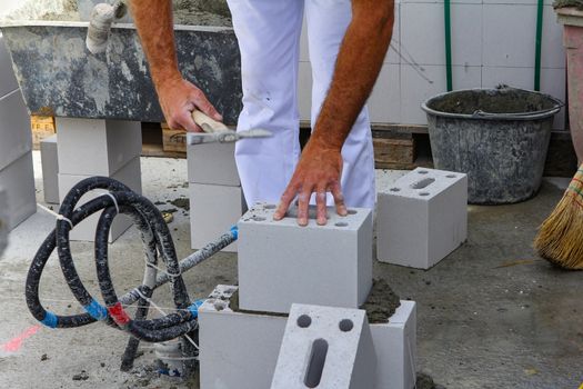 Hard working people at construction site With white pants