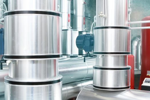 chrome pipes in heating and AC rooms in buildings of factories and hospital. with silver and green color