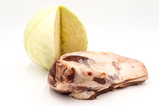 Lamb shoulder and white cabbage on a white background